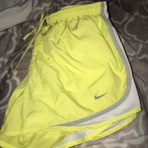 yellow, white & grey nike shorts